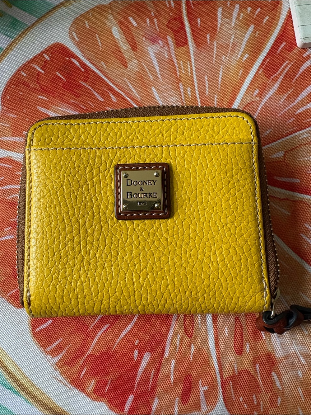 Dooney & Bourke Yellow Pebbled Leather Zip-Around Wallet with Logo Plaque